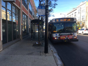 CIty of MIlwaukee bus on a city street.