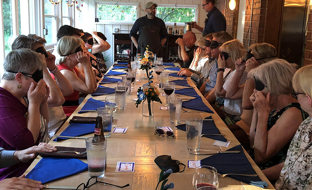 Vignette’s Chef Mark greets Dining in the Dark attendees