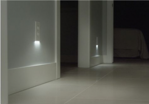 A hallway floor and smart outlets with LED lights.