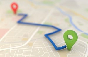 Google Maps graphic showing a blue route from a red point to a green point.
