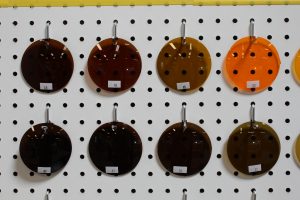 Eight different lens options on display on a board.