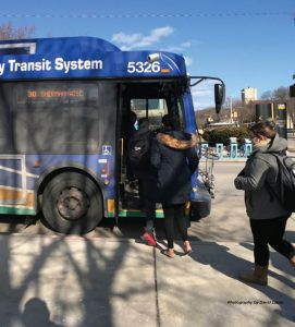 People getting on a bus