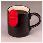 A Liquid Level Indicator hangs on the edge of a coffee mug.