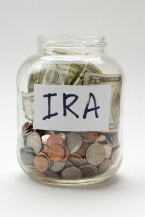 A jar of money with an “IRA” label on it.