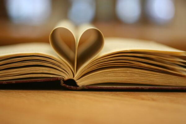 A book with pages folded into a heart.