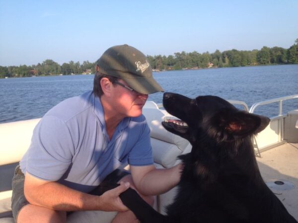 Macintosh HD:Users:hannahwente:Downloads:Photos_of_Gary_Traynor_and_Guide_Dog,_Fishing:gary and reuben fishing 2.jpg