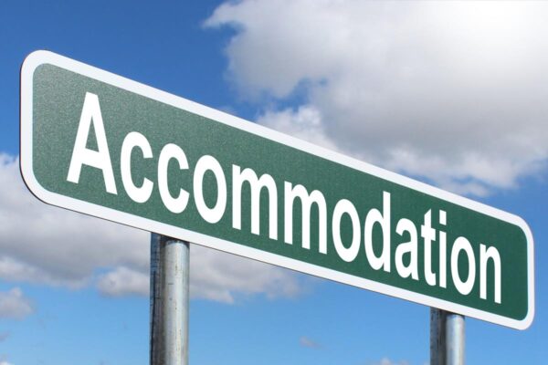 Road sign with accommodation written on it