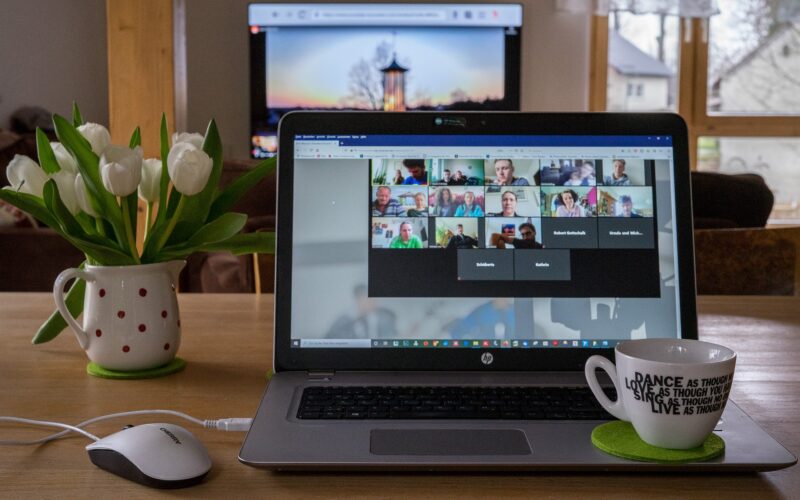Laptop with a virtual meeting on the screen
