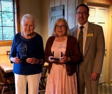 Doris Dolph, Suzy DeVriend holding awards with Robert BestBest.
