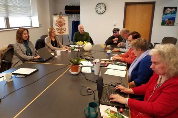 Members of the WCBVI board sitting at a large table.