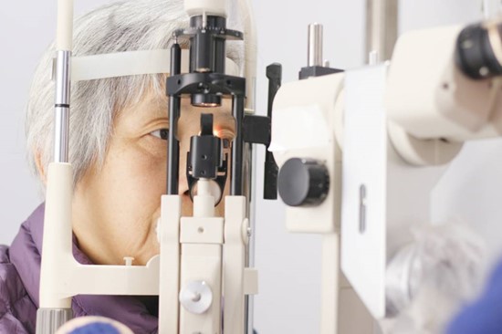 A woman having her eyes examined