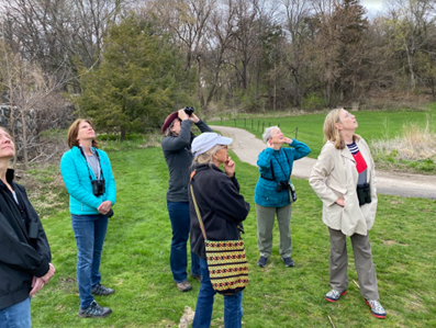 A group of six birders looking upward