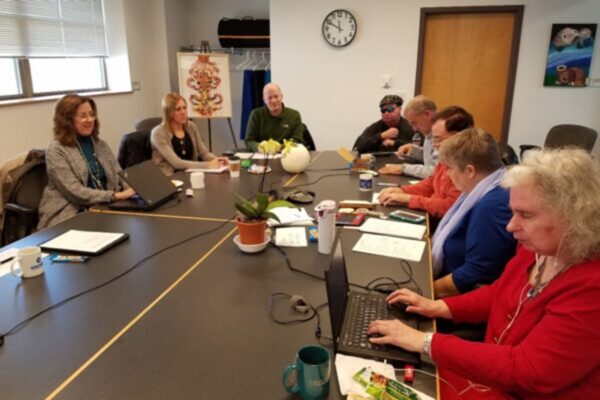 Members of the Council board sitting at a large table.