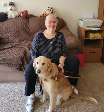 Rosemary Goodrich sitting with her guide dog Yaffa