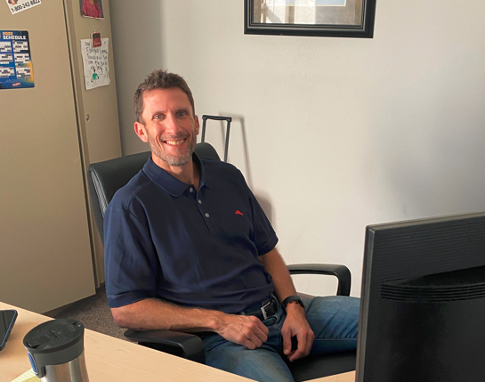 Brent Perzentka sitting at his desk