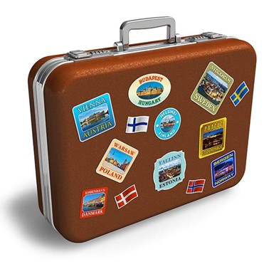 A suitcase with stickers from many different countries on it