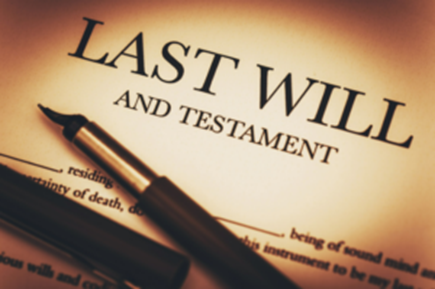 A fountain pen resting on a document that says Last Will and Testament