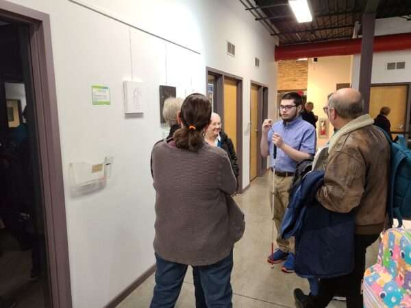 A group of people having a conversation at Gallery Night