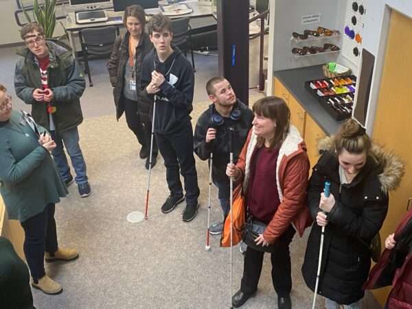 Visitors standing in the Sharper Vision Store