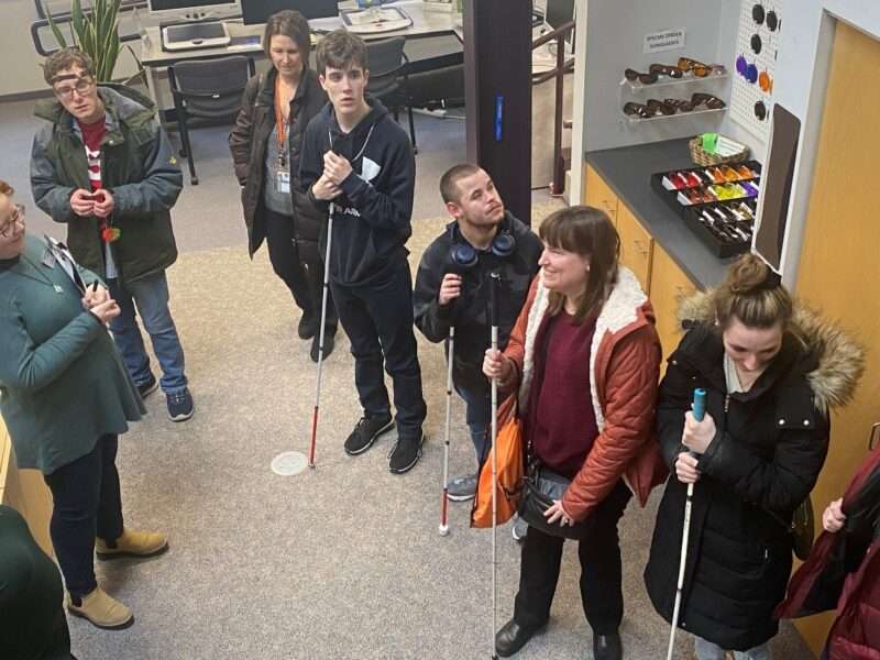 Visitors standing in the Sharper Vision Store