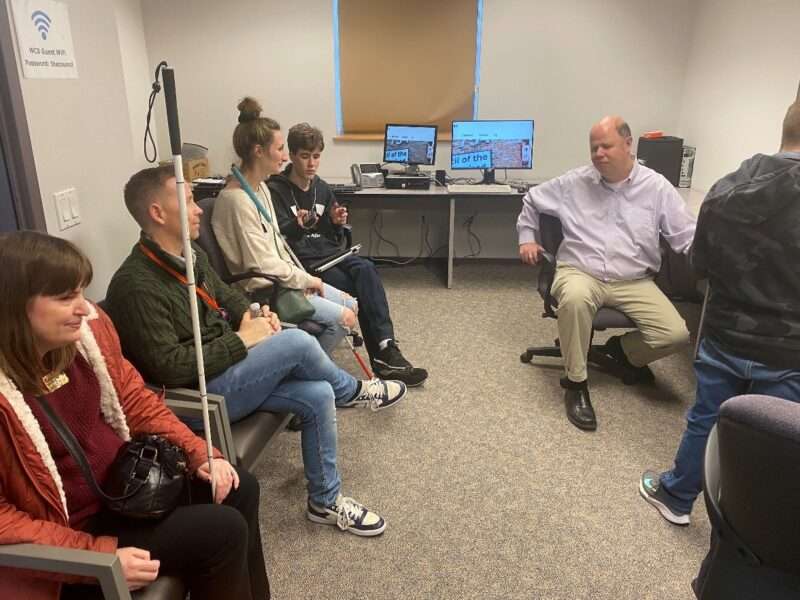 Jim Denham and visitors in the access technology classroom