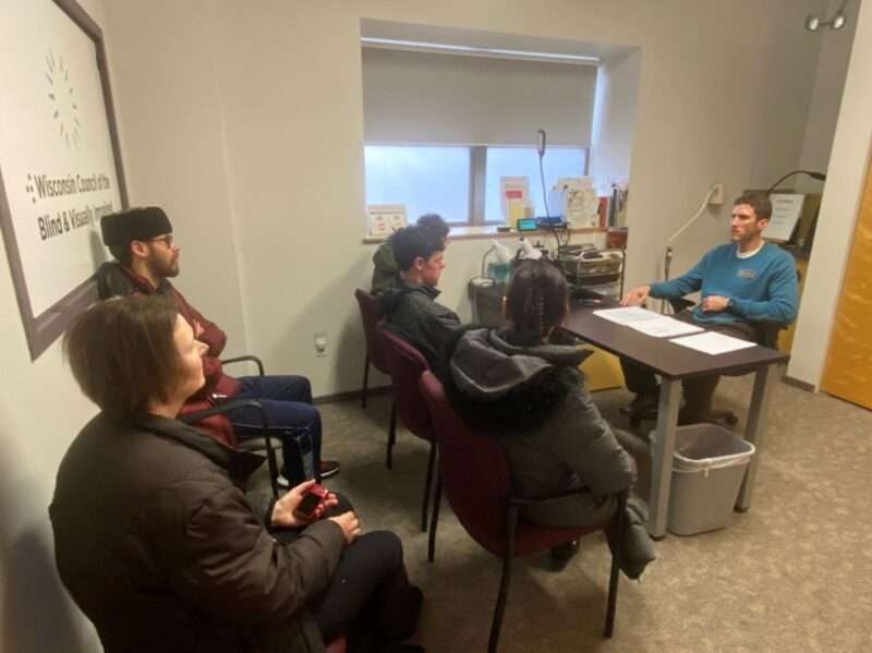 Brent Perzentka with a group of visiting students