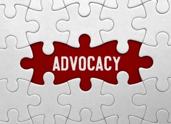 A jigsaw puzzle with the word Advocacy in place of the missing pieces.