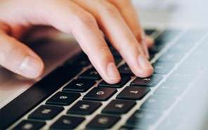 Fingers on a computer keyboard