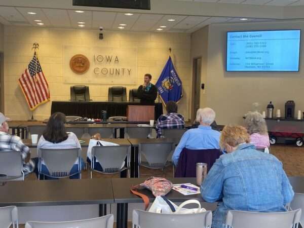 Brent Perzentka at the front of a room giving a presentation.