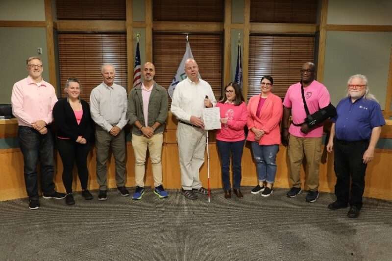 Jim Denham accepting a White Cane Safety Day proclamation from the Fitchburg City Council.