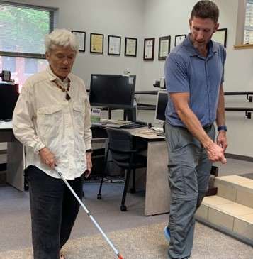 Brent Perzentka showing an O&M client white cane technique.