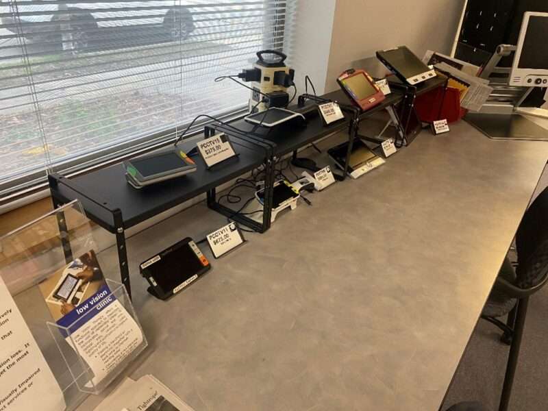 Digital magnifiers on display on a table in the Sharper Vision Store.