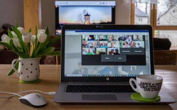 Laptop with a virtual meeting on the screen