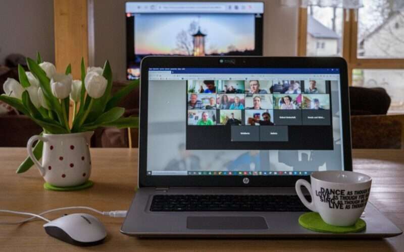 Laptop with a virtual meeting on the screen