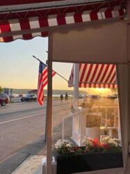 Photograph of the entrance to an ice cream parlor across the street from the water