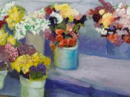 Several vases hold bright-colored floral arrangements on a step.