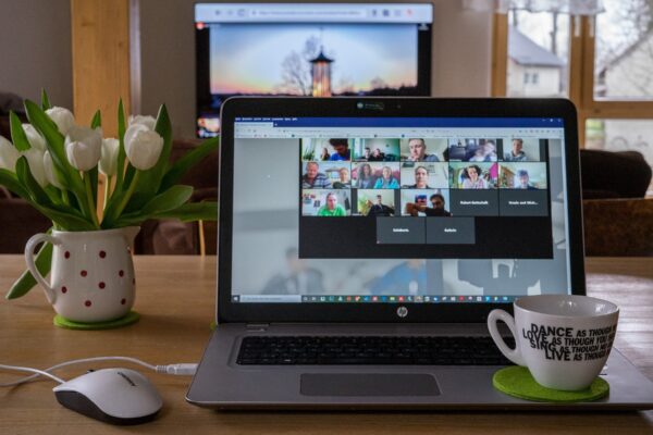 Laptop with a virtual meeting on the screen